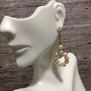 Hand made earrings with texturized pearls.